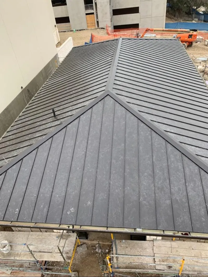 Commercial metal roof construction with crane equipment in Tamalpais-Homestead Valley